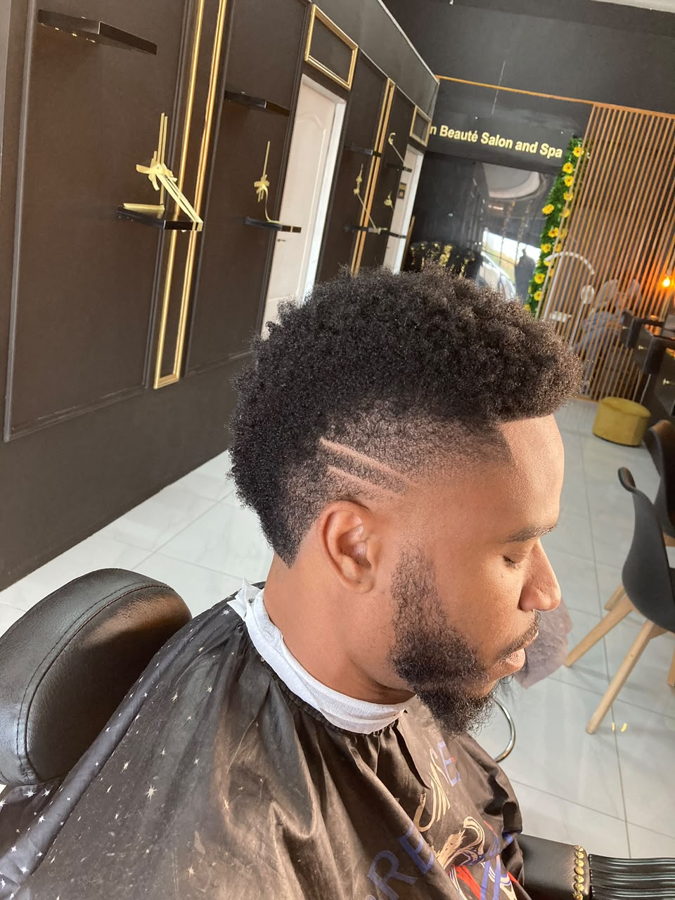 Sharp fade haircut by Sam The Barber's Grooming